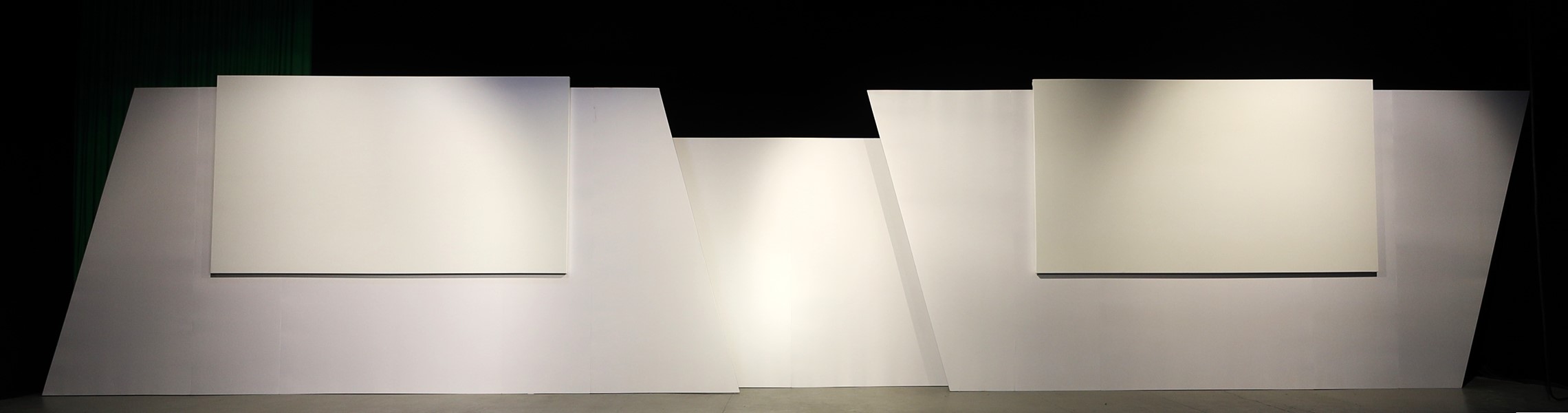 Stage Backdrops for Events - backdrop system AV drop Stage backdrops for events with double depth, two asymmetrical sides with borders and two front projection screens on each side.