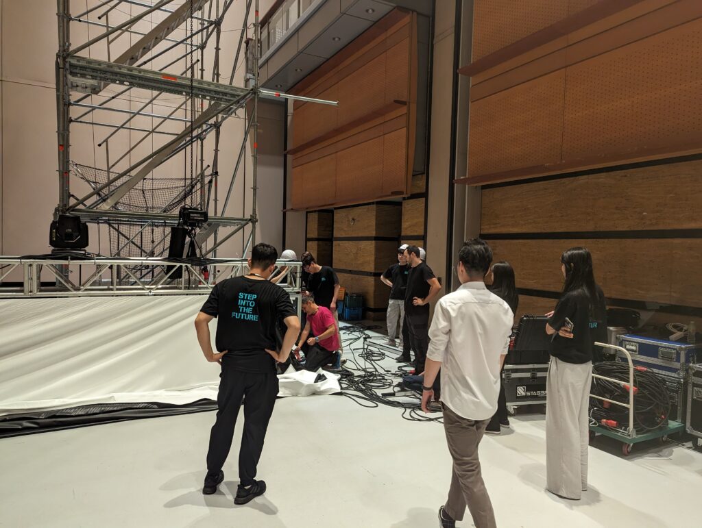 Unveiling the Spectacular: Coex Open House 2023 - backdrop system AV drop The whole team working on the underscreen of the giant projection screen for the Coex Open House 2023.
