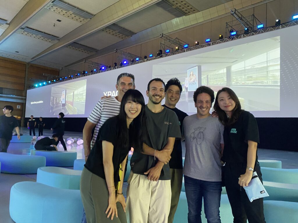 Unveiling the Spectacular: Coex Open House 2023 - backdrop system AV drop Coex & AV Drop team with the giant projection screen behind them for the Coex Open House 2023